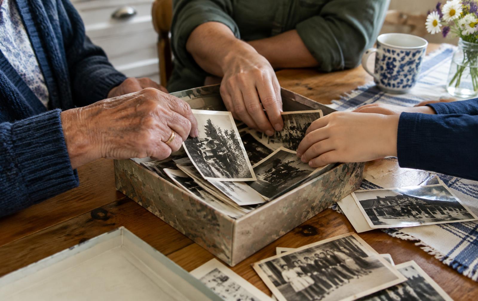 Family looking through a box of old photographs together